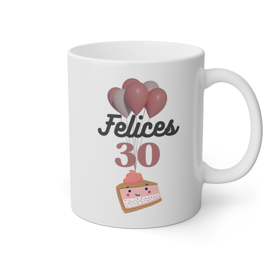 Taza blanca con una tarta y globos y la frase felices 30 
